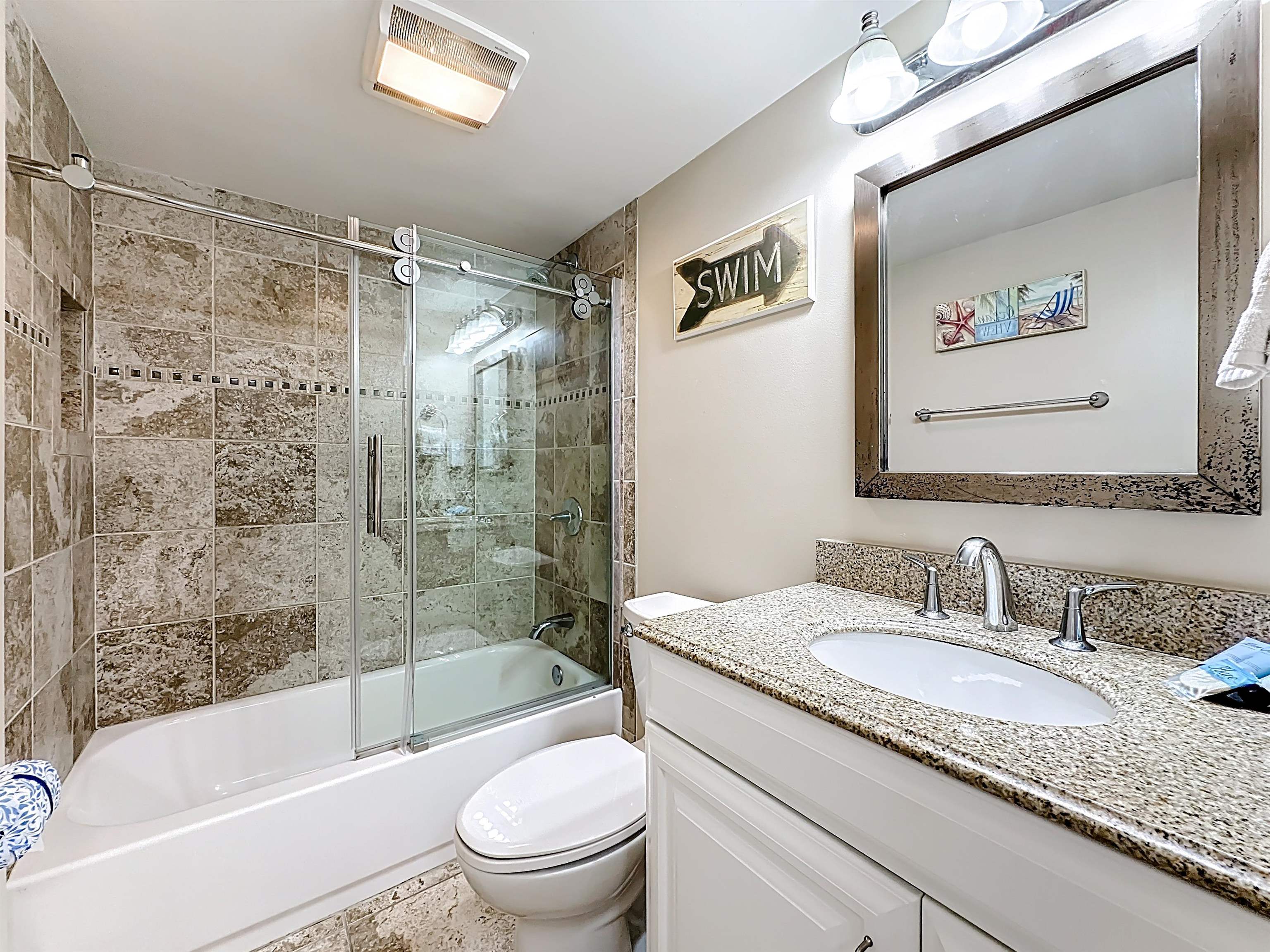 4 Ocean Trace Road, Unit 213 St. Augustine, FL 32080 - Photo 23 of 38 a bathroom with a granite countertop sink toilet and shower