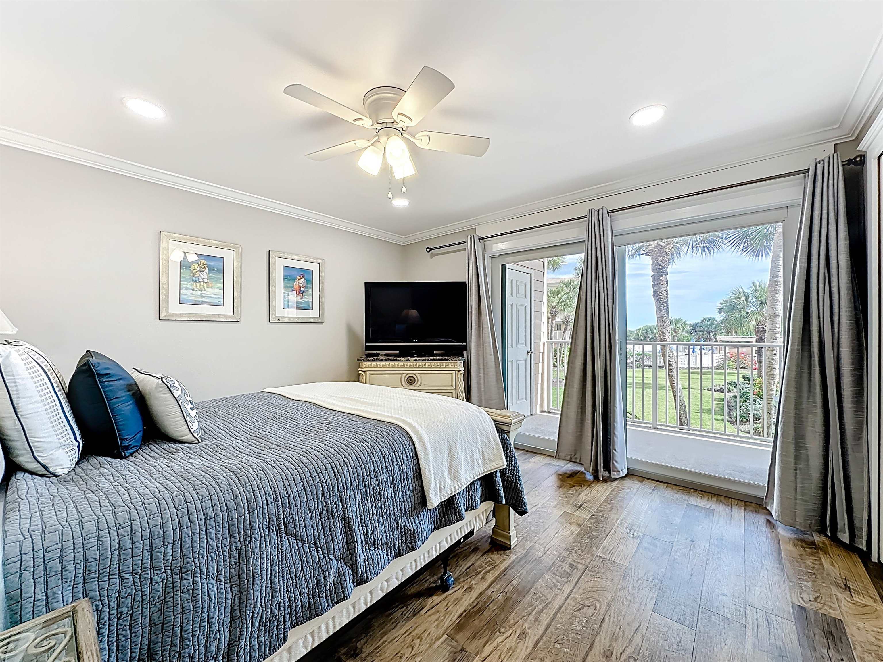 4 Ocean Trace Road, Unit 213 St. Augustine, FL 32080 - Photo 24 of 38 a bedroom with a large bed and a tv