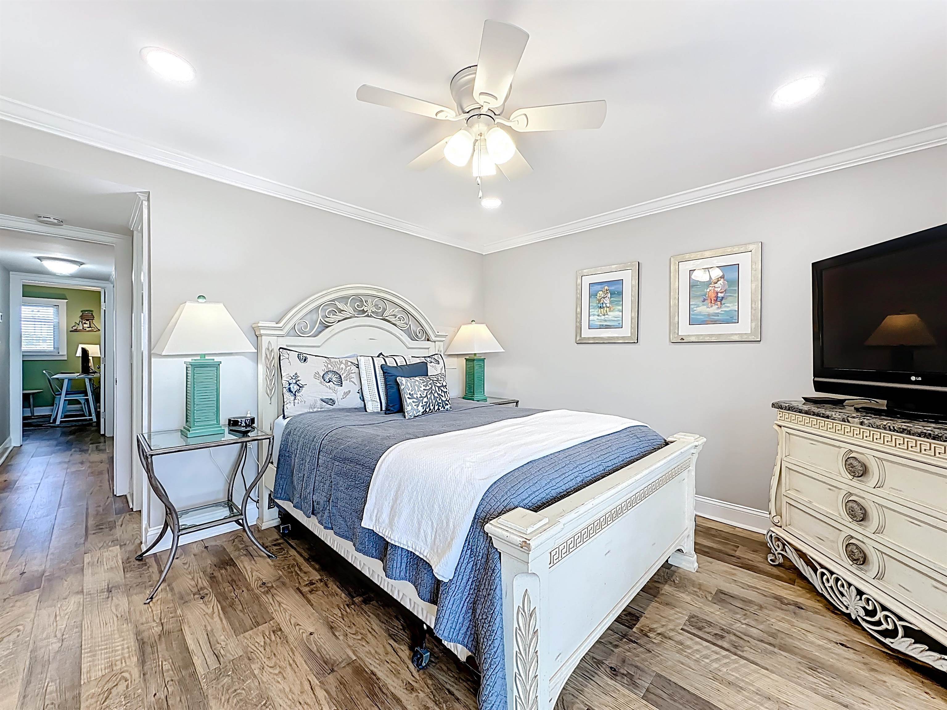 4 Ocean Trace Road, Unit 213 St. Augustine, FL 32080 - Photo 25 of 38 a bedroom with a bed and a flat screen tv