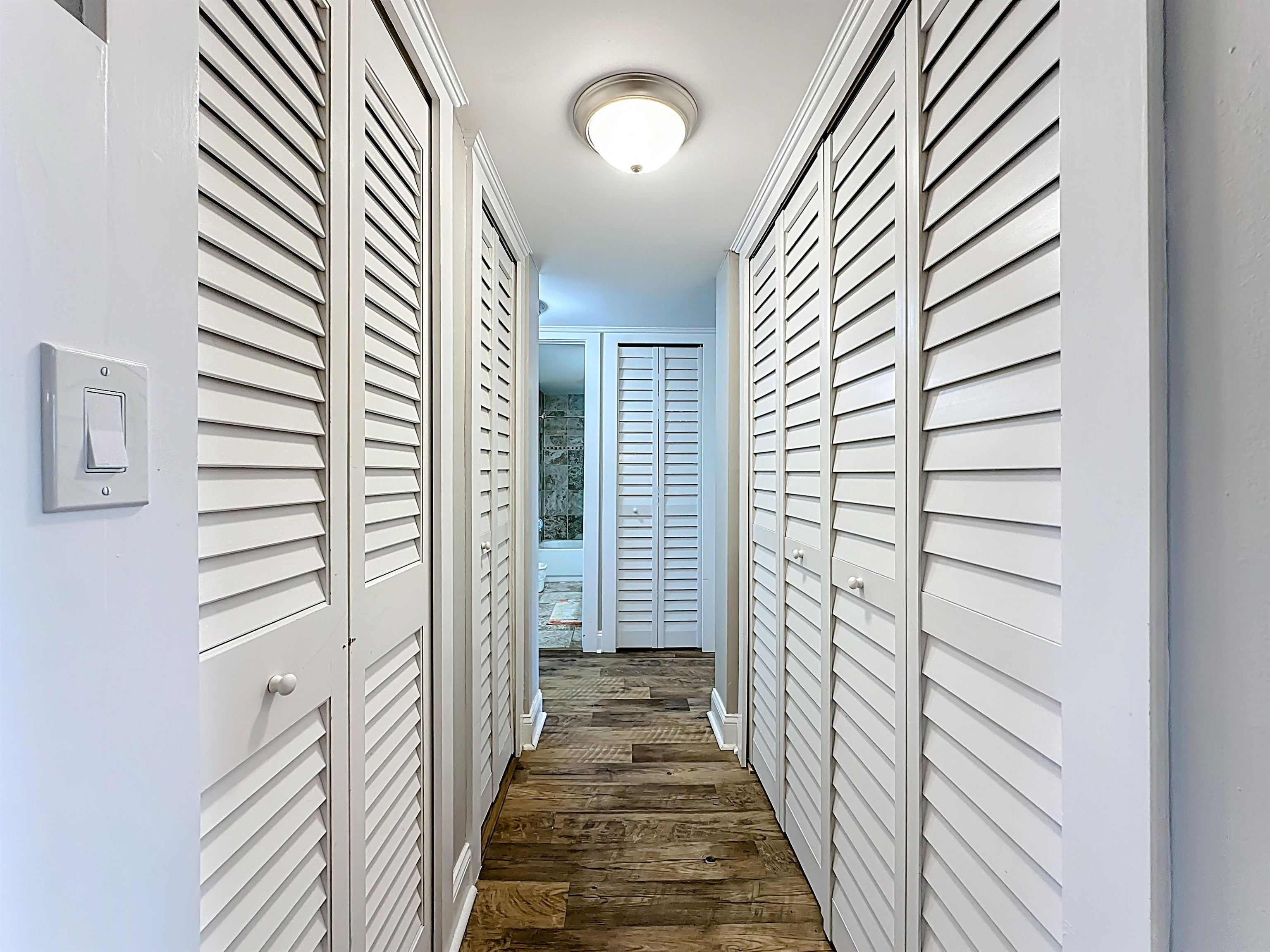 4 Ocean Trace Road, Unit 213 St. Augustine, FL 32080 - Photo 29 of 38 a view of a hallway with wooden floor and windows