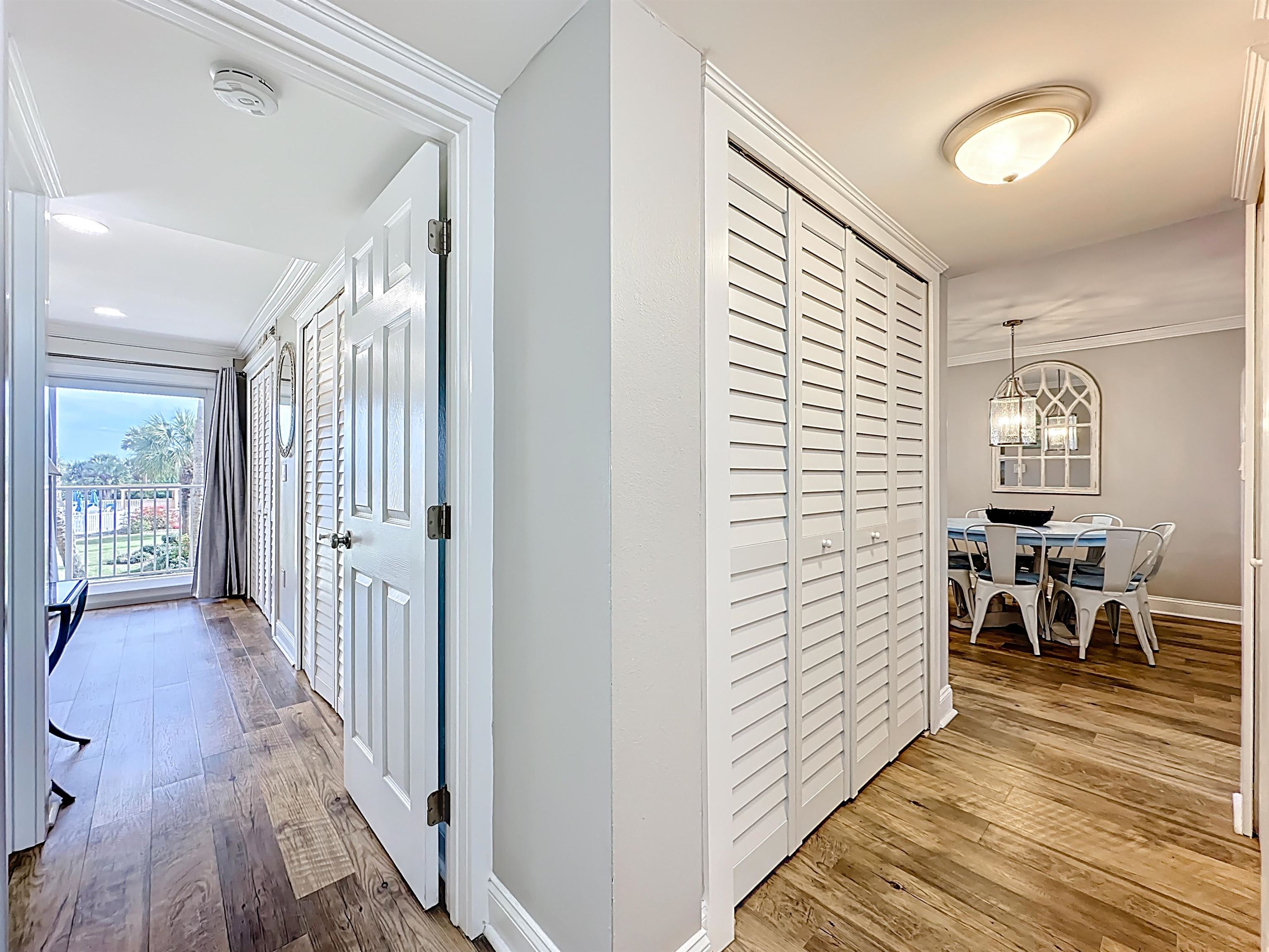 4 Ocean Trace Road, Unit 213 St. Augustine, FL 32080 - Photo 30 of 38 a view of a hallway with wooden floor and a windows