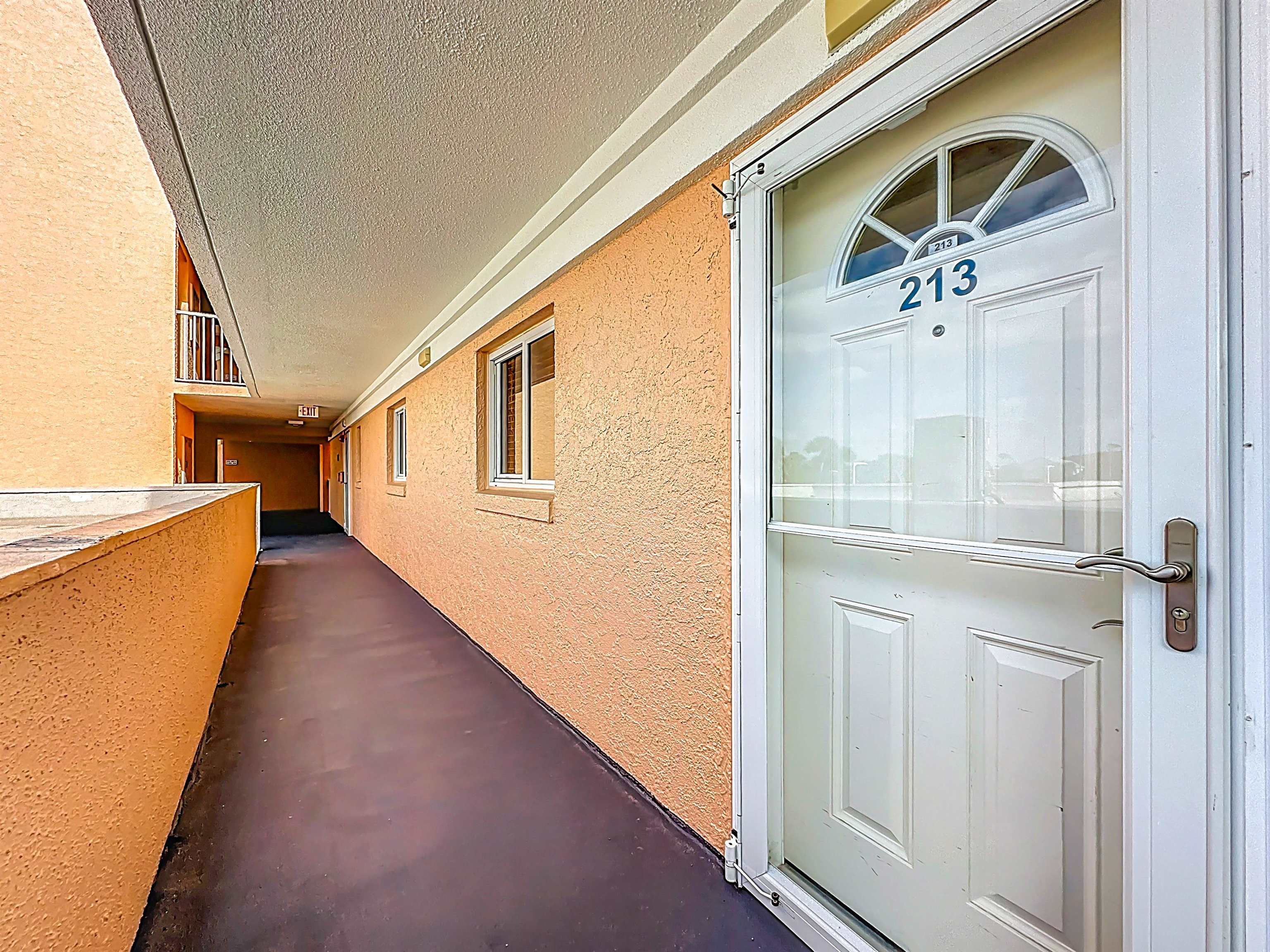 4 Ocean Trace Road, Unit 213 St. Augustine, FL 32080 - Photo 4 of 38 a view of a stairs and an entryway
