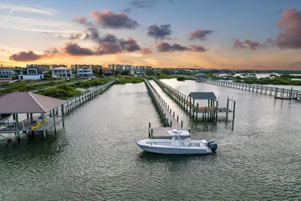 a view of a lake with a table and chairs
