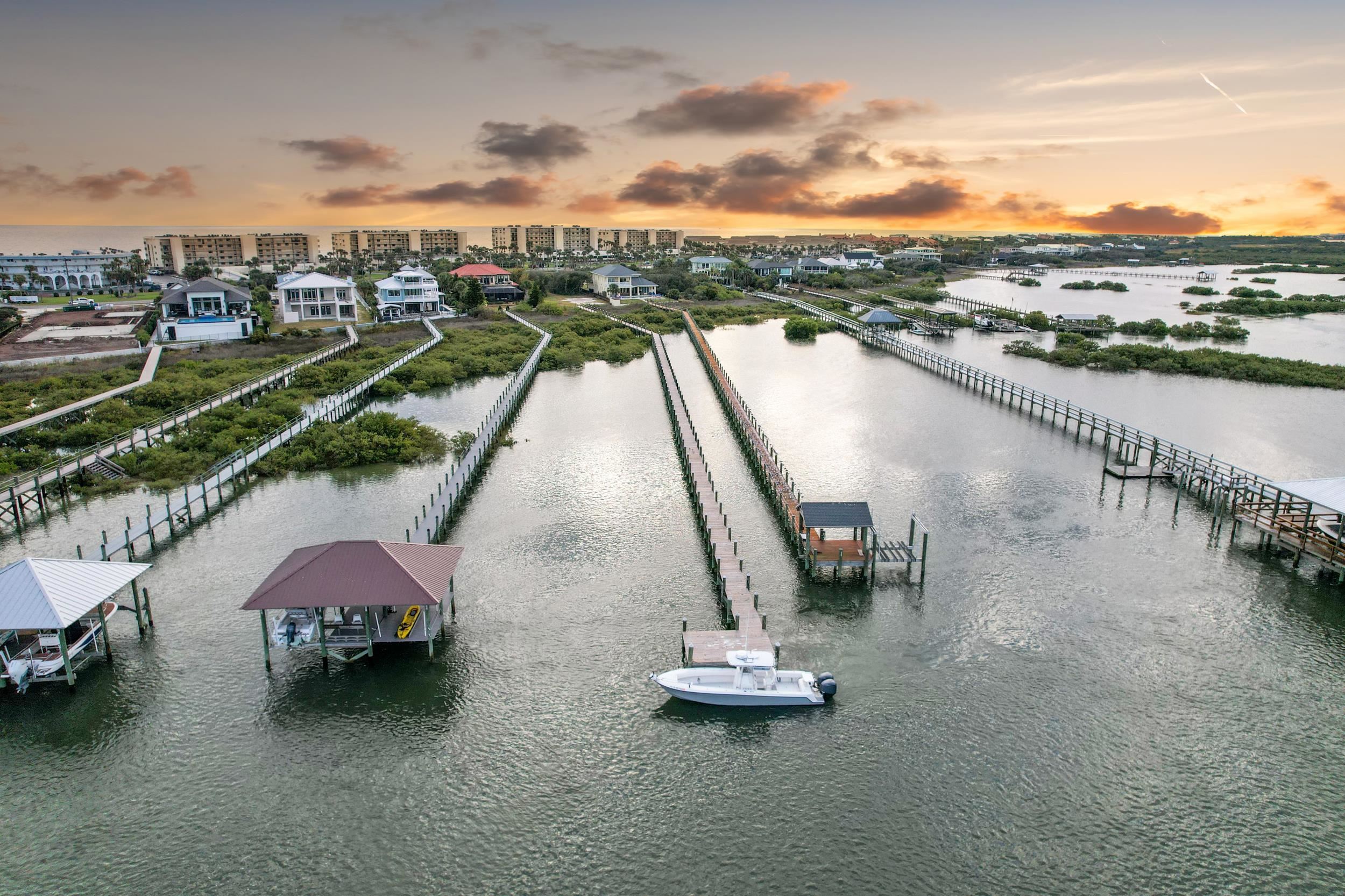 7975 A1A South St. Augustine, FL 32080 - Photo 24 of 33 a view of a lake with a table and chairs
