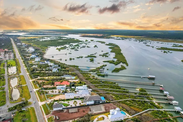 a view of a lake with a table and chairs