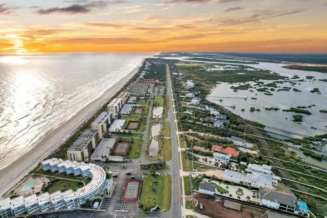 an aerial view of house with a yard