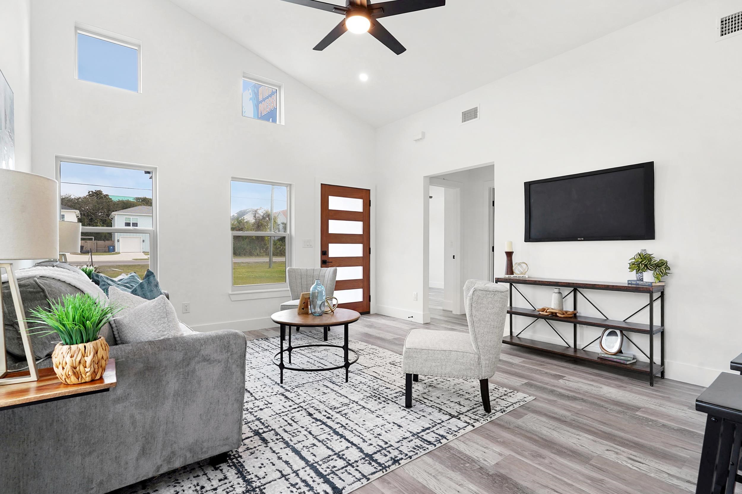 7975 A1A South St. Augustine, FL 32080 - Photo 7 of 33 a living room with furniture and a flat screen tv