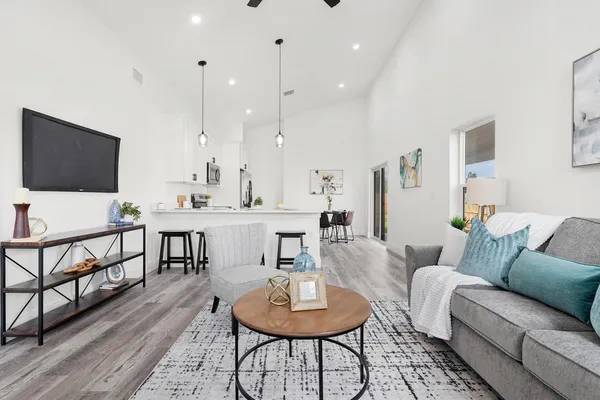 a living room with furniture and a flat screen tv