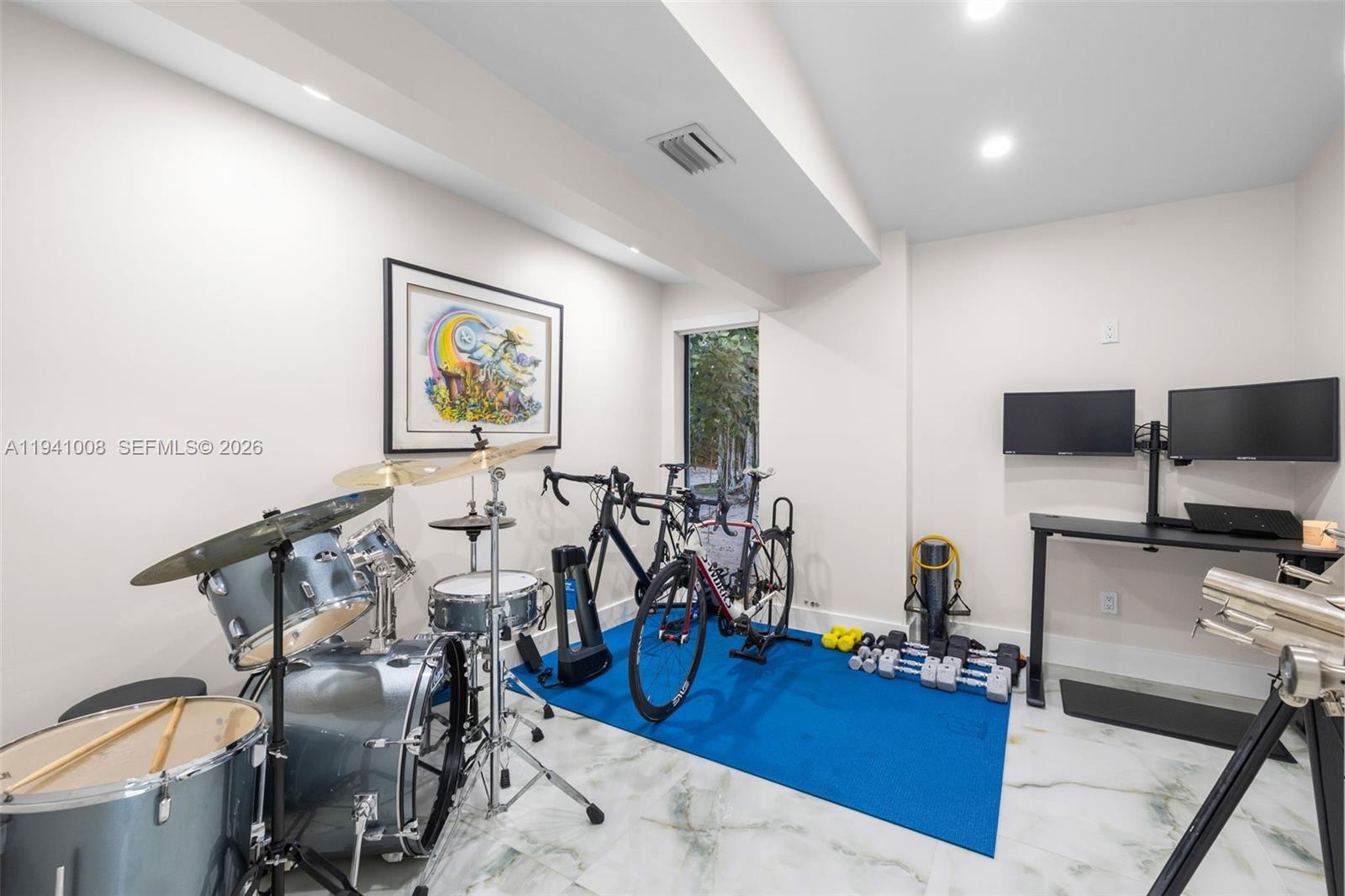 12033 Acme Road Wellington, FL 33414 - Photo 12 of 30 a view of a room with gym equipment