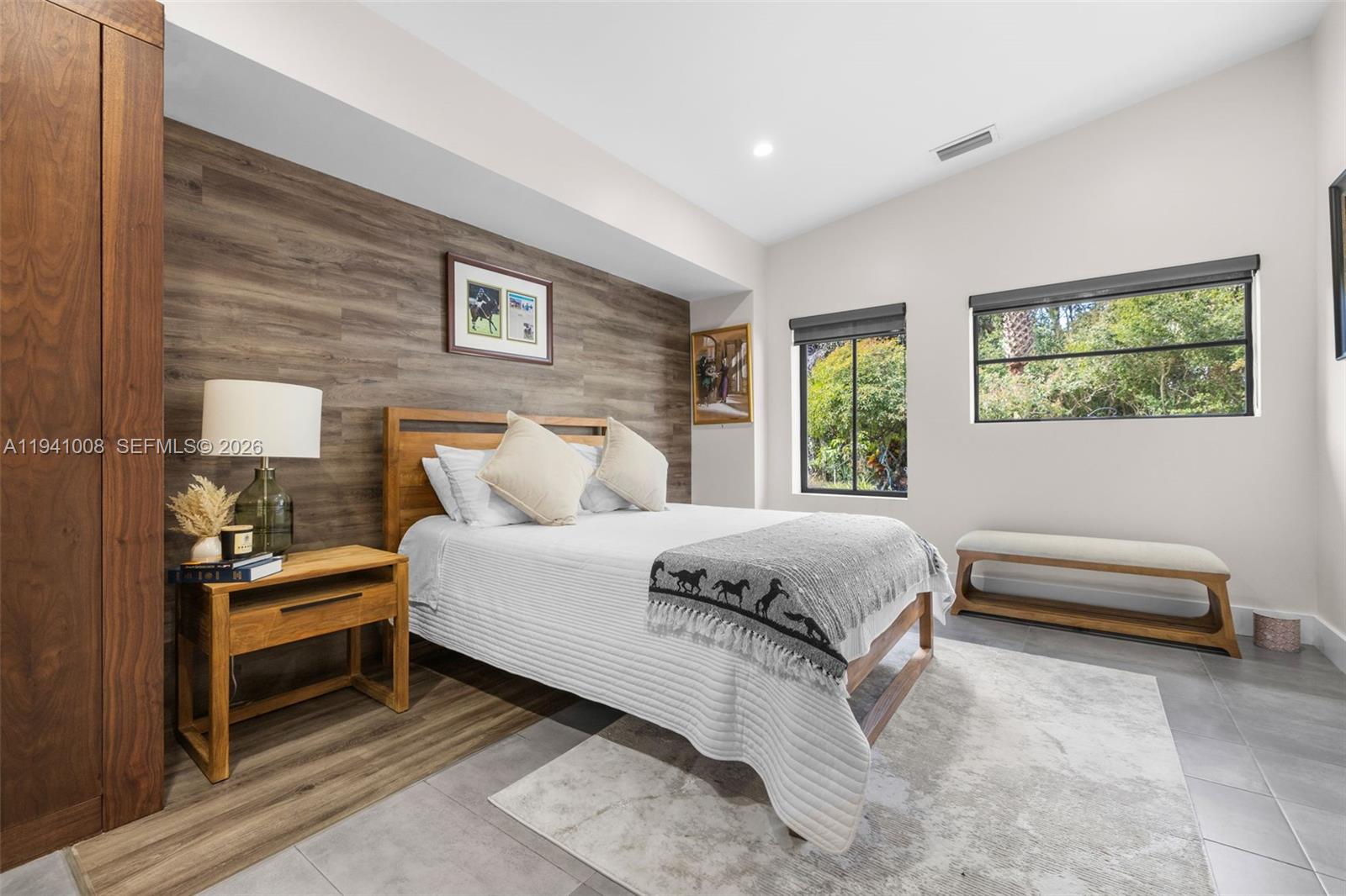 12033 Acme Road Wellington, FL 33414 - Photo 15 of 30 a spacious bedroom with a bed and a window