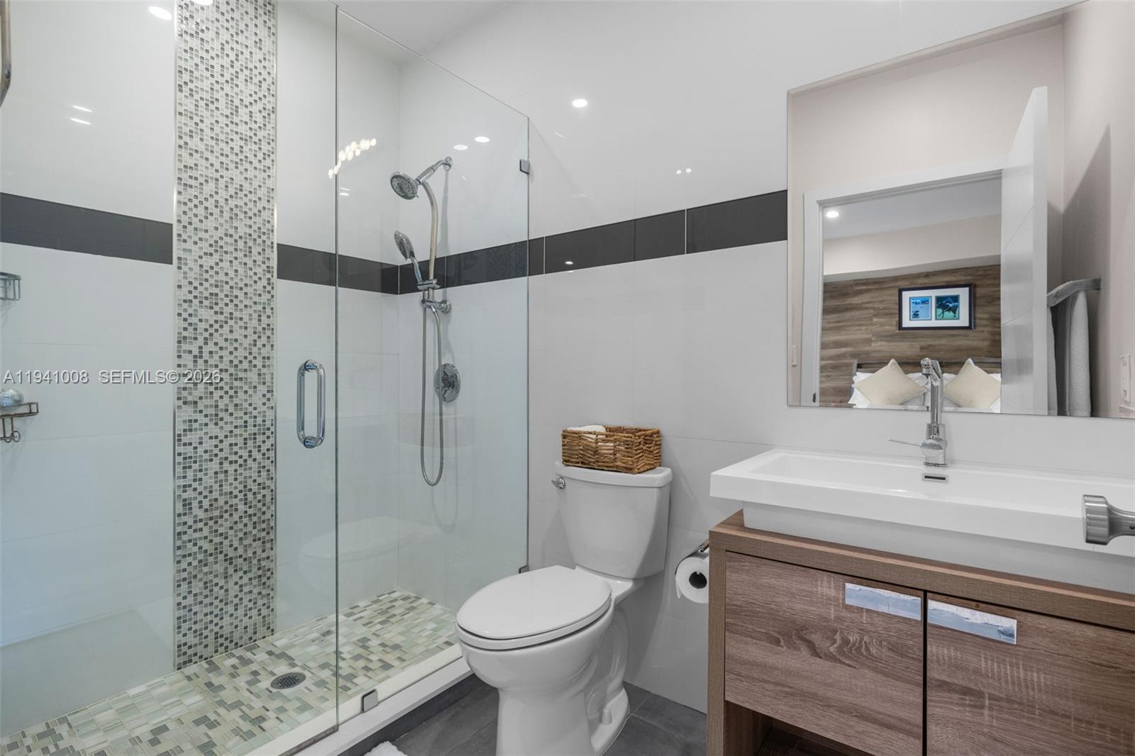 12033 Acme Road Wellington, FL 33414 - Photo 17 of 30 a bathroom with a sink toilet and shower