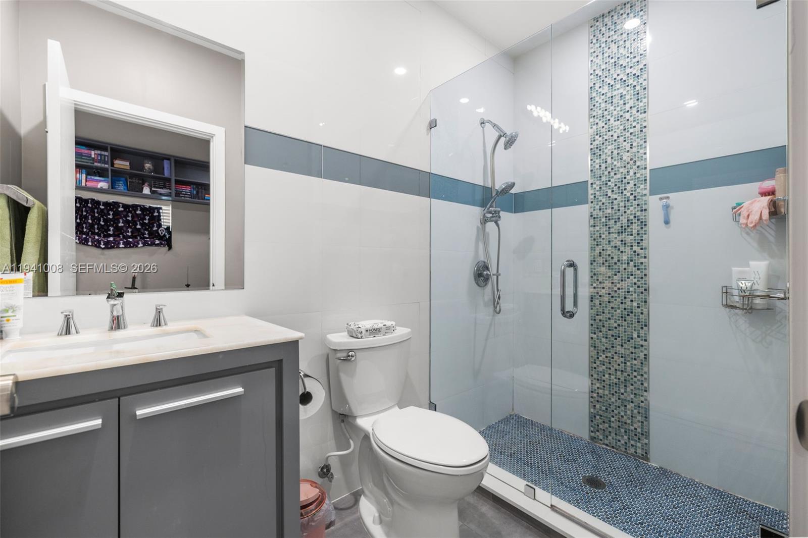 12033 Acme Road Wellington, FL 33414 - Photo 19 of 30 a bathroom with a sink toilet and shower