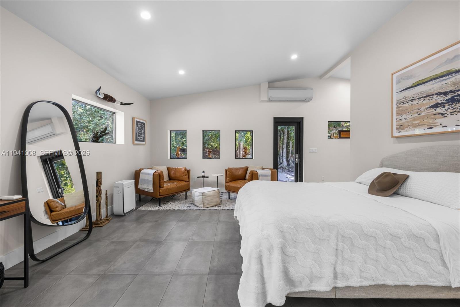 12033 Acme Road Wellington, FL 33414 - Photo 20 of 30 a bedroom with furniture and a mirror