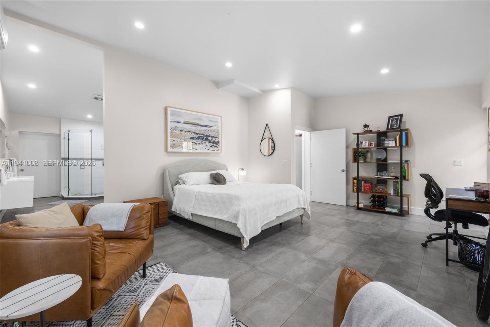 12033 Acme Road Wellington, FL 33414 - Photo 22 of 30 a bedroom with a bed and a couch