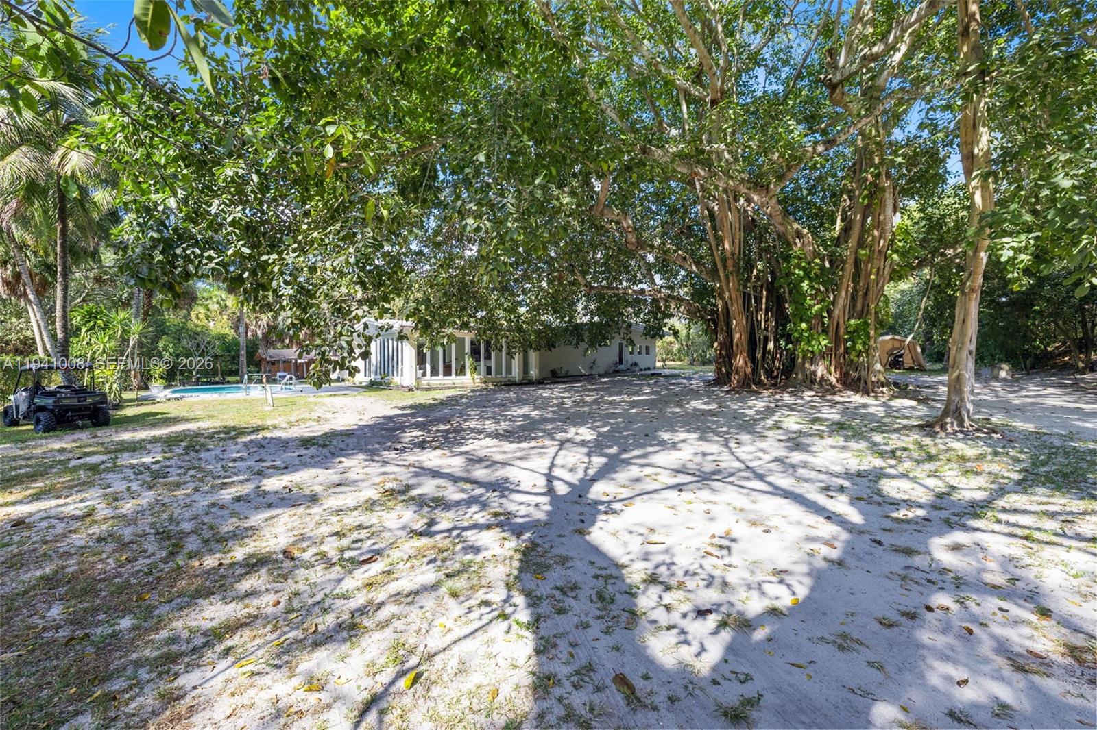 12033 Acme Road Wellington, FL 33414 - Photo 28 of 30 a view of outdoor space with trees