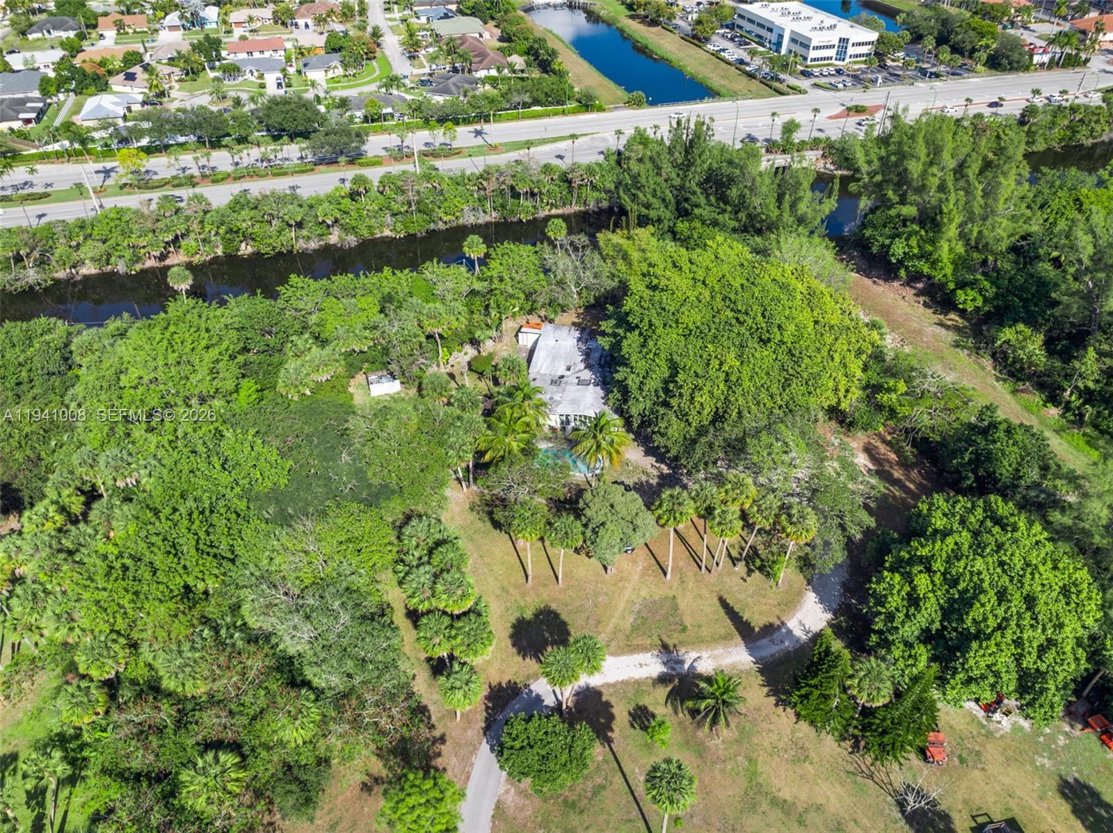 12033 Acme Road Wellington, FL 33414 - Photo 30 of 30 a view of a garden with a lake