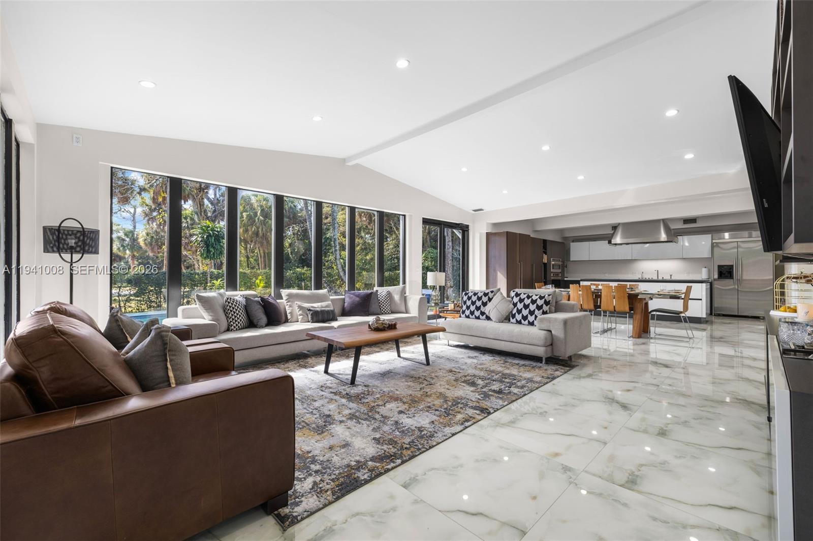 12033 Acme Road Wellington, FL 33414 - Photo 4 of 30 a living room with furniture and a large window