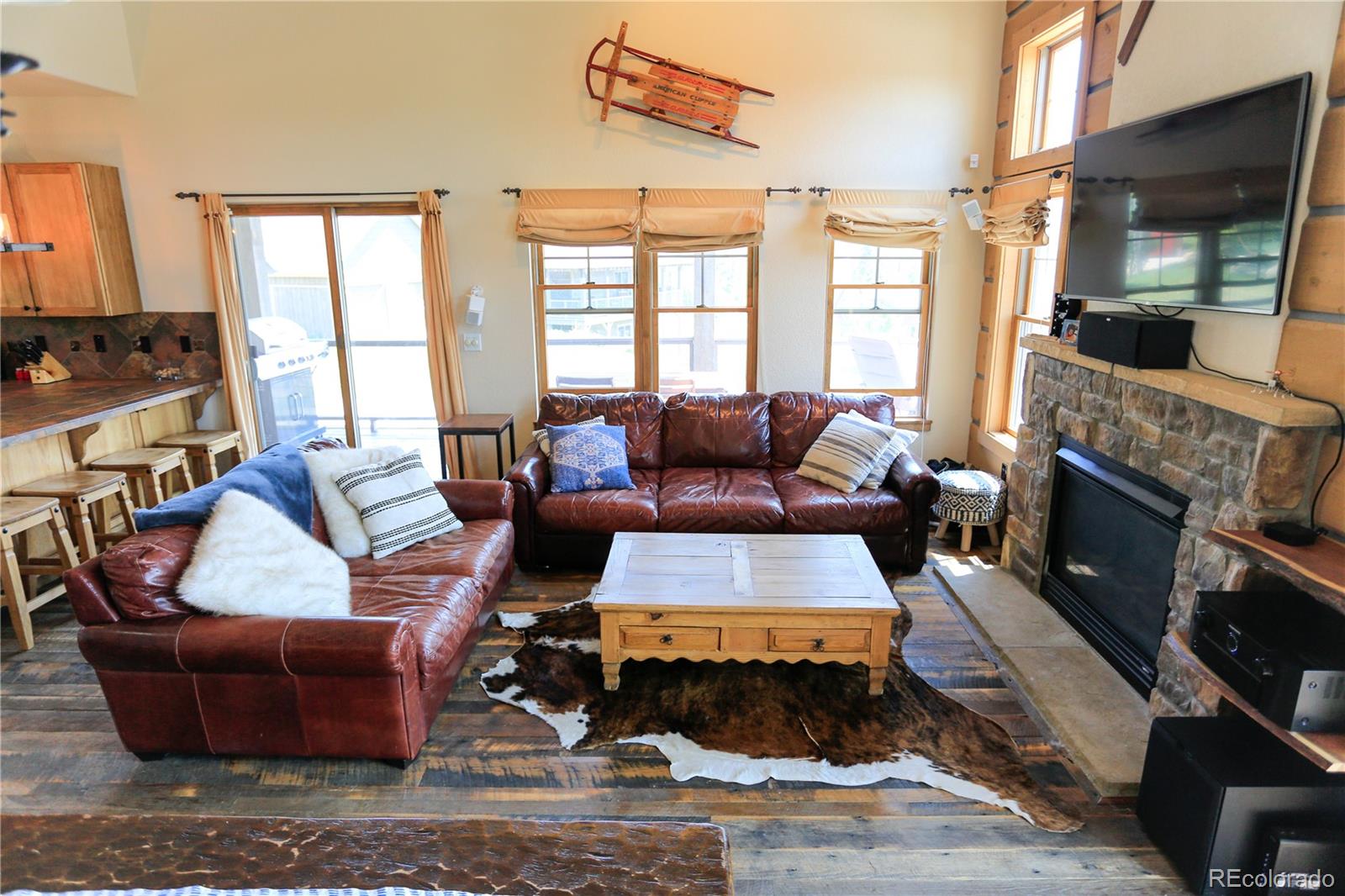 1324 Rendezvous Road Fraser, CO 80442 - Photo 11 of 36 a living room with furniture fireplace and a large window