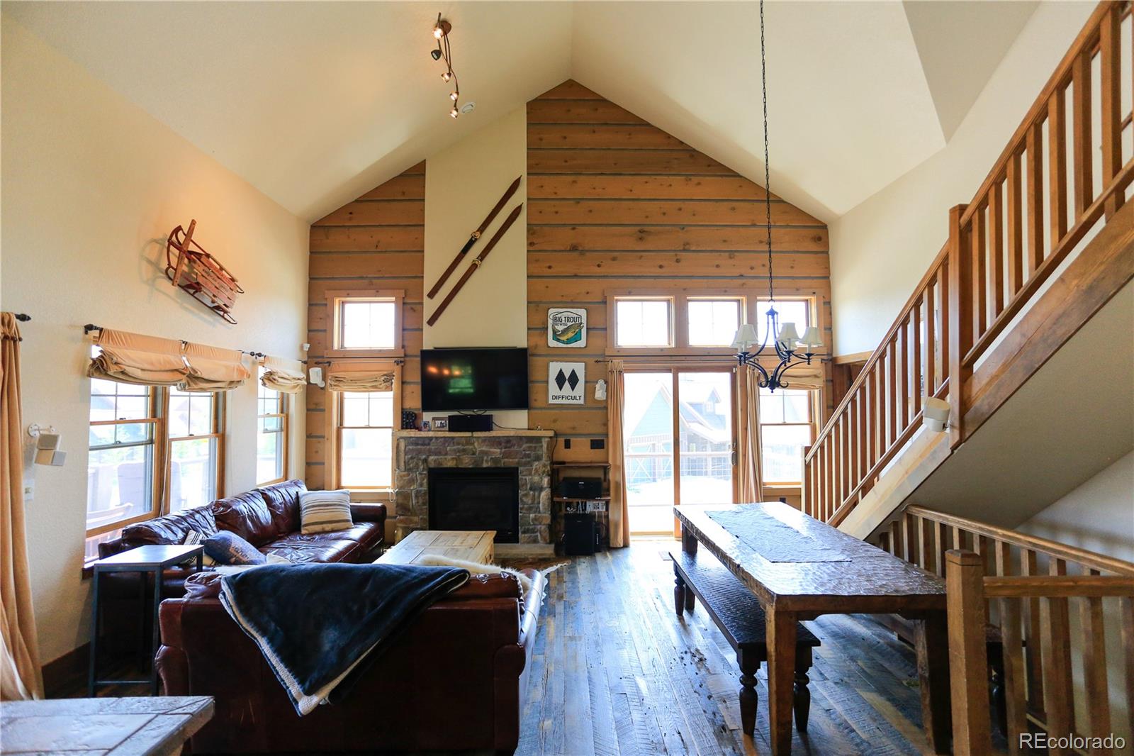 1324 Rendezvous Road Fraser, CO 80442 - Photo 12 of 36 a living room with furniture a fireplace and a flat screen tv