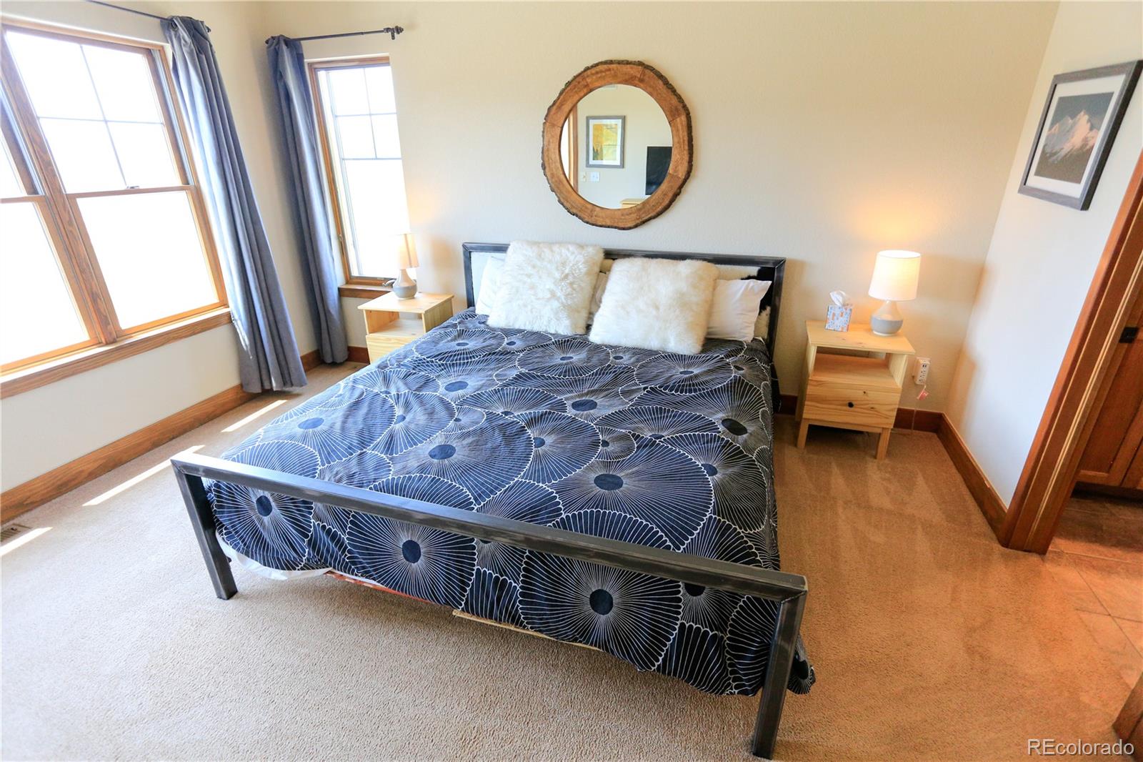 1324 Rendezvous Road Fraser, CO 80442 - Photo 18 of 36 a bedroom with a bed and a window