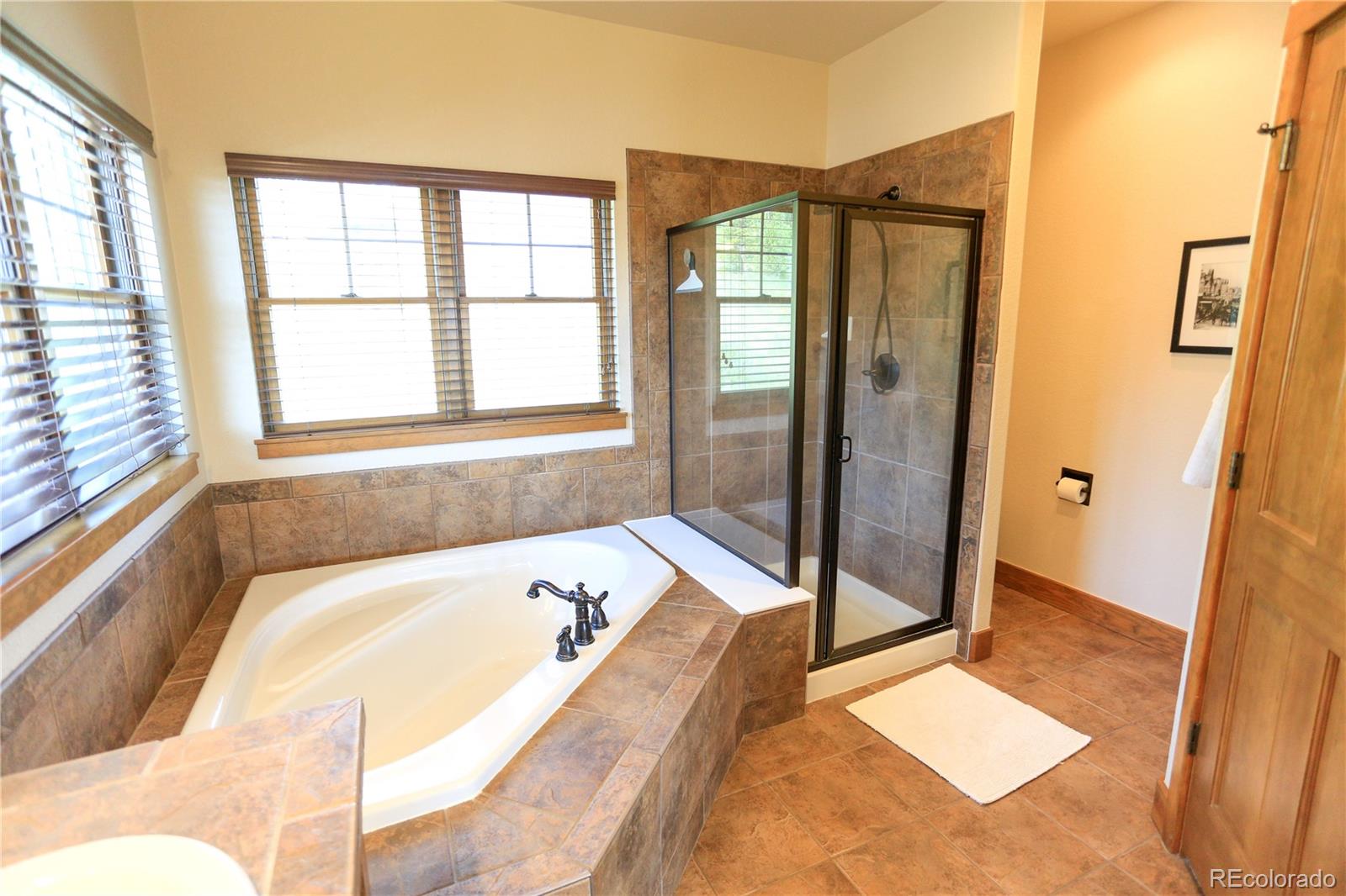 1324 Rendezvous Road Fraser, CO 80442 - Photo 22 of 36 a bathroom with a tub and shower