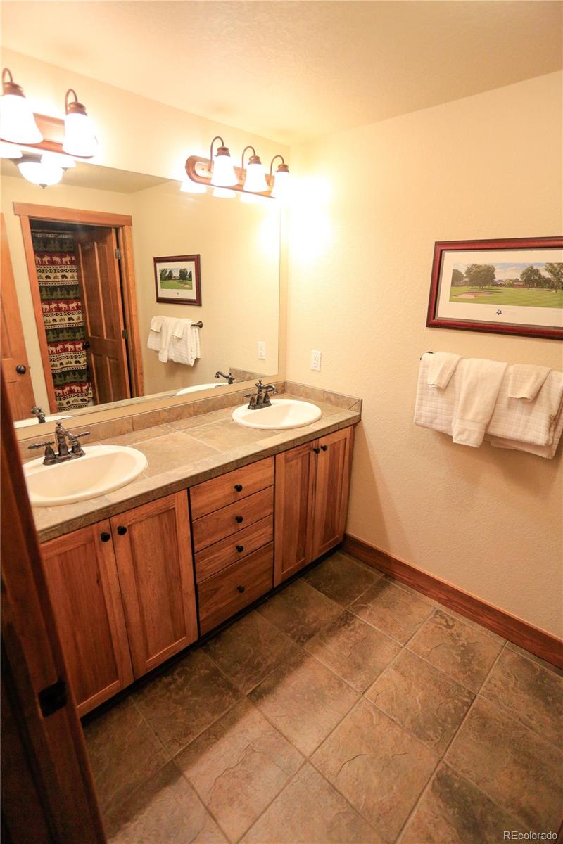 1324 Rendezvous Road Fraser, CO 80442 - Photo 26 of 36 a bathroom with a sink and a mirror