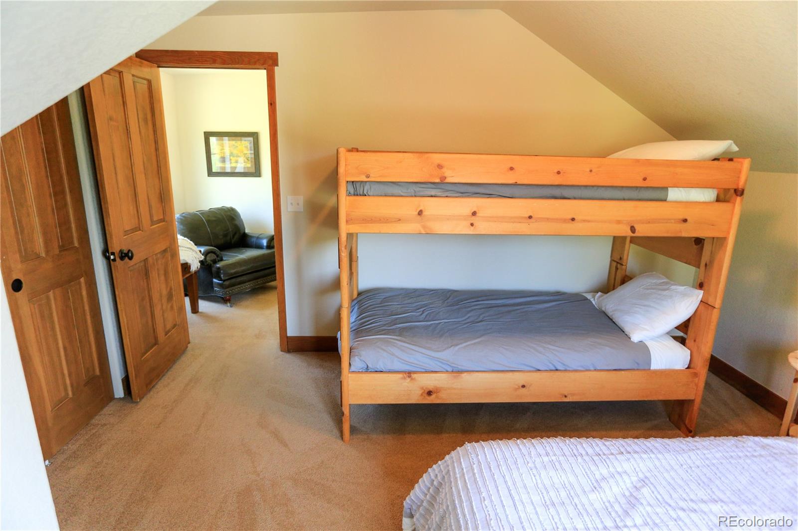 1324 Rendezvous Road Fraser, CO 80442 - Photo 28 of 36 a bedroom with a bunk bed and a desk