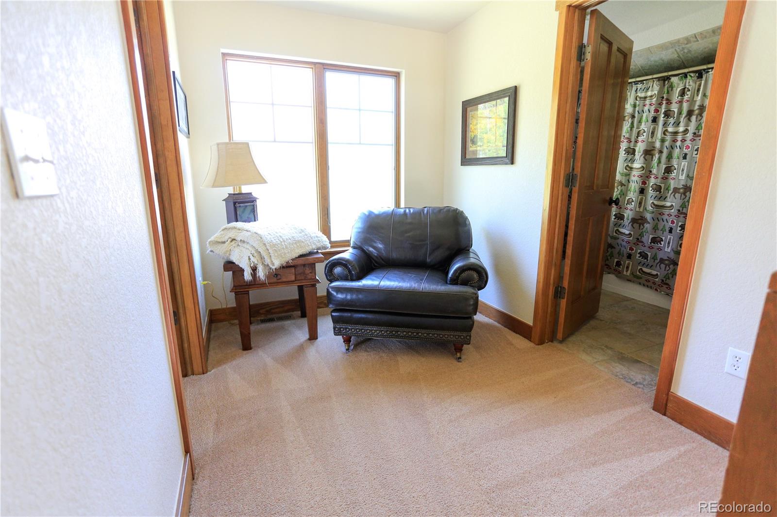 1324 Rendezvous Road Fraser, CO 80442 - Photo 30 of 36 a living room with furniture and a window