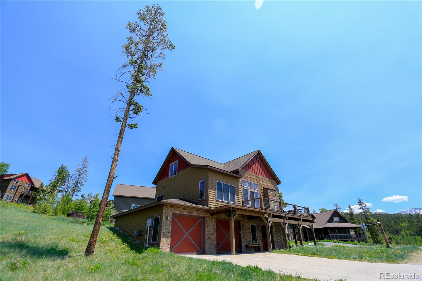 1324 Rendezvous Road Fraser, CO 80442 - Photo 5 of 36 a view of a big house with a big yard and large trees