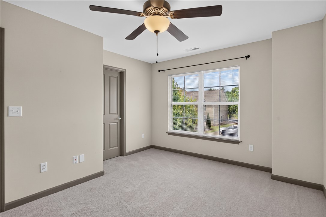 235 Pendleton Road, Unit K1 Clemson, SC 29631 - Photo 33 of 49 A quiet bedroom offers ample light and a ceiling fan for comfortable living.