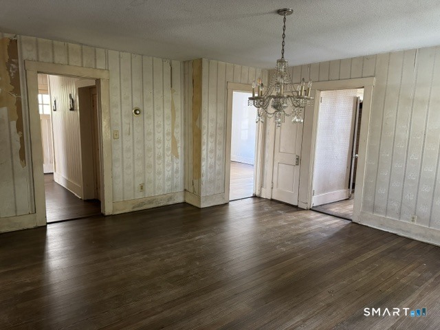 408 Huntington Road Scotland, CT 06264 - Photo 3 of 10 an empty room with wooden floor and windows