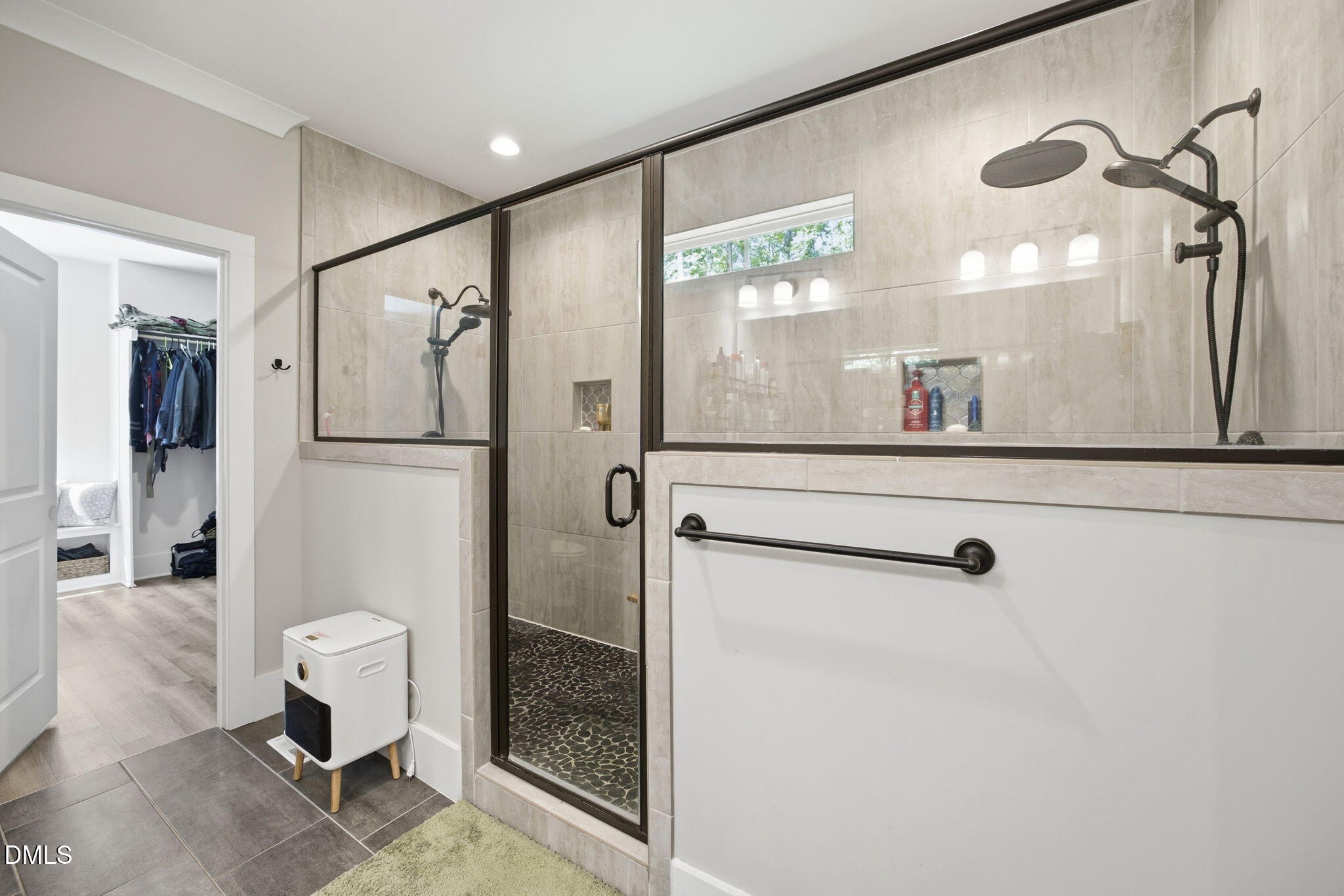 3511 Bruce Garner Road Wake Forest, NC 27587 - Photo 22 of 56 a bathroom with a glass shower door