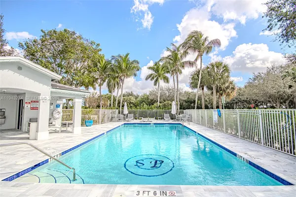 a view of swimming pool with a patio