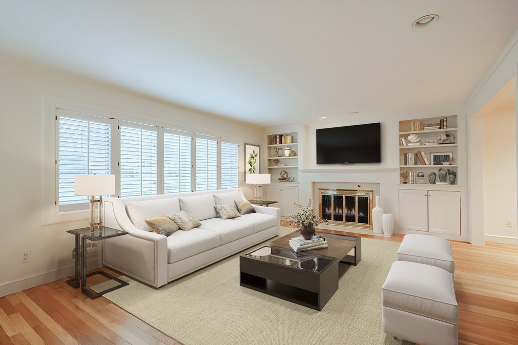 35 Windemere Road Wellesley, MA 02481 - Photo 2 of 24 a living room with furniture a fireplace and a flat screen tv