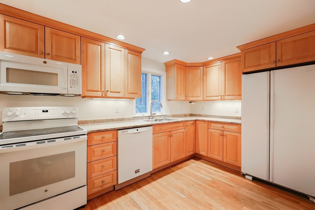 35 Windemere Road Wellesley, MA 02481 - Photo 6 of 24 a kitchen with stainless steel appliances granite countertop a refrigerator sink and cabinets