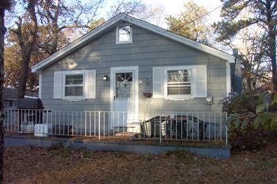 11 Child's Road Mashpee, MA 02649 - Photo 1 of 4 a front view of a house with a yard