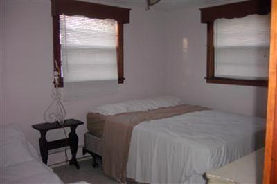 11 Child's Road Mashpee, MA 02649 - Photo 4 of 4 a bedroom with a bed and a window