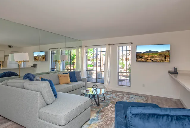 a living room with furniture and a large window