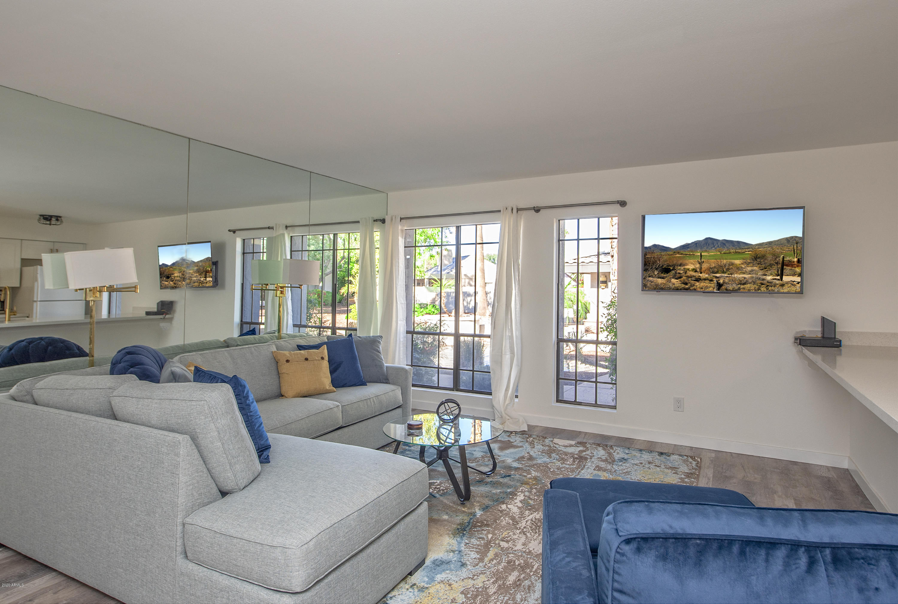 5209 North 24th Street, Unit 103 Phoenix, AZ 85016 - Photo 1 of 17 a living room with furniture and a large window