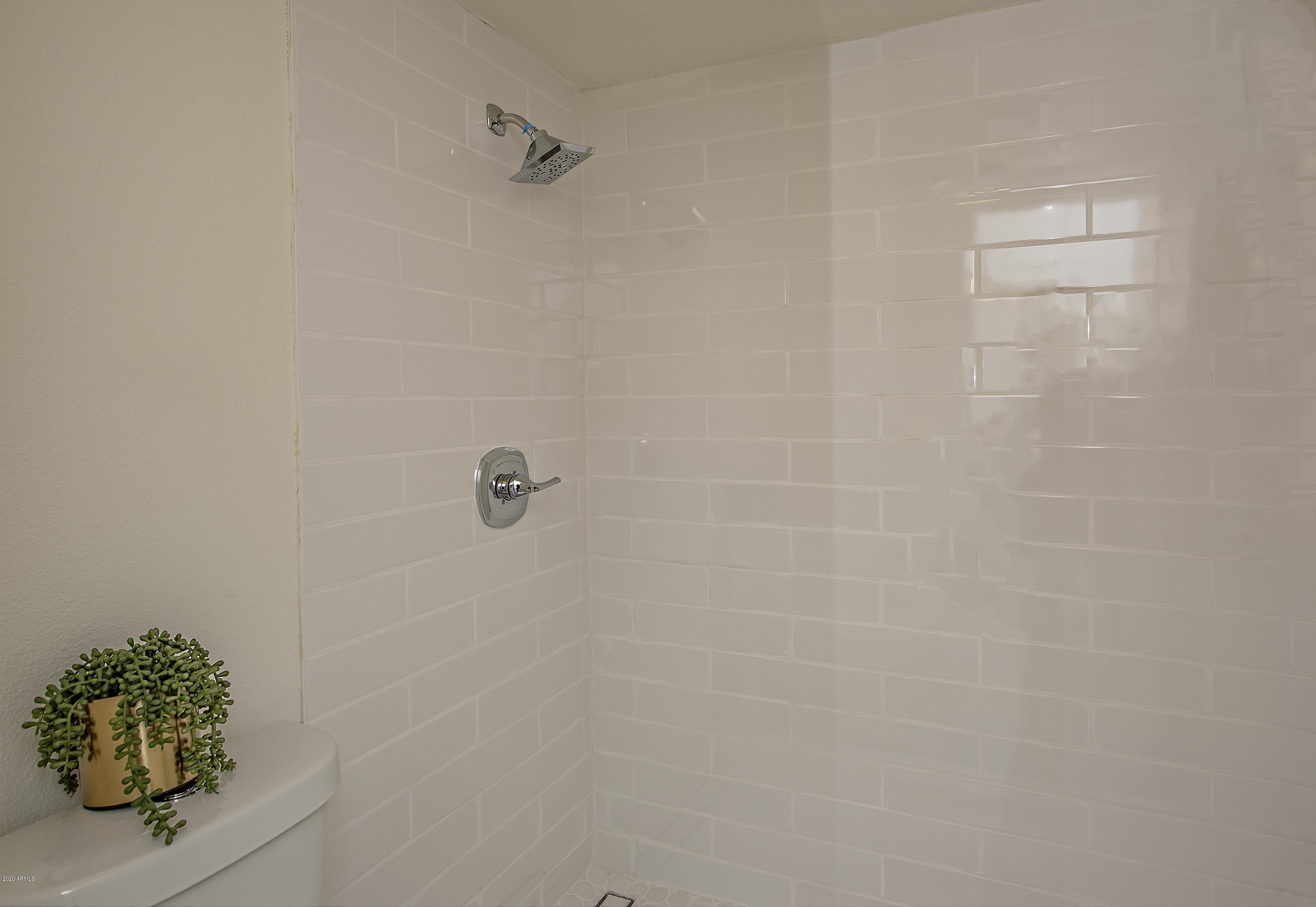 5209 North 24th Street, Unit 103 Phoenix, AZ 85016 - Photo 11 of 17 a bathroom with a shower
