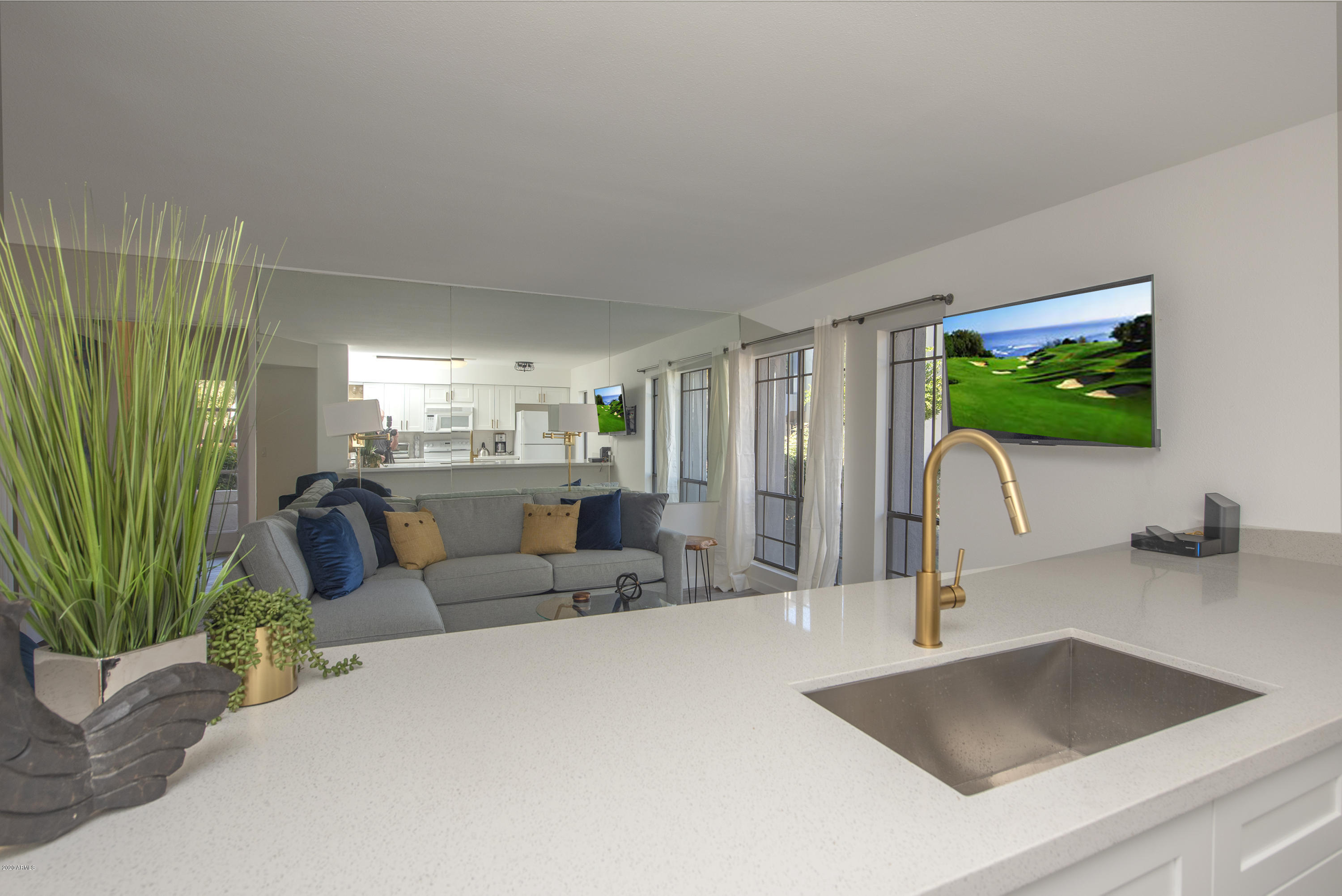 5209 North 24th Street, Unit 103 Phoenix, AZ 85016 - Photo 4 of 17 a living room with furniture window and a potted plant