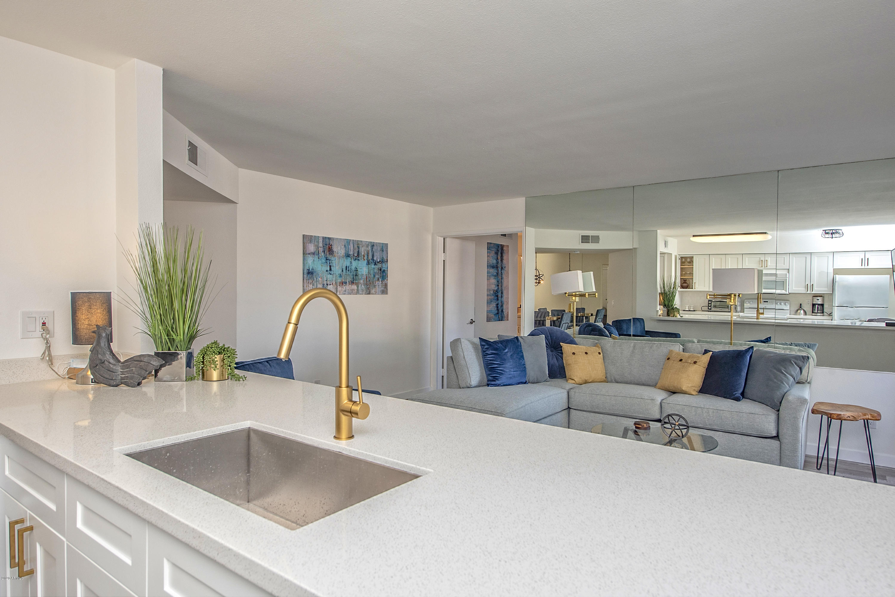 5209 North 24th Street, Unit 103 Phoenix, AZ 85016 - Photo 5 of 17 a kitchen with a refrigerator and a sink