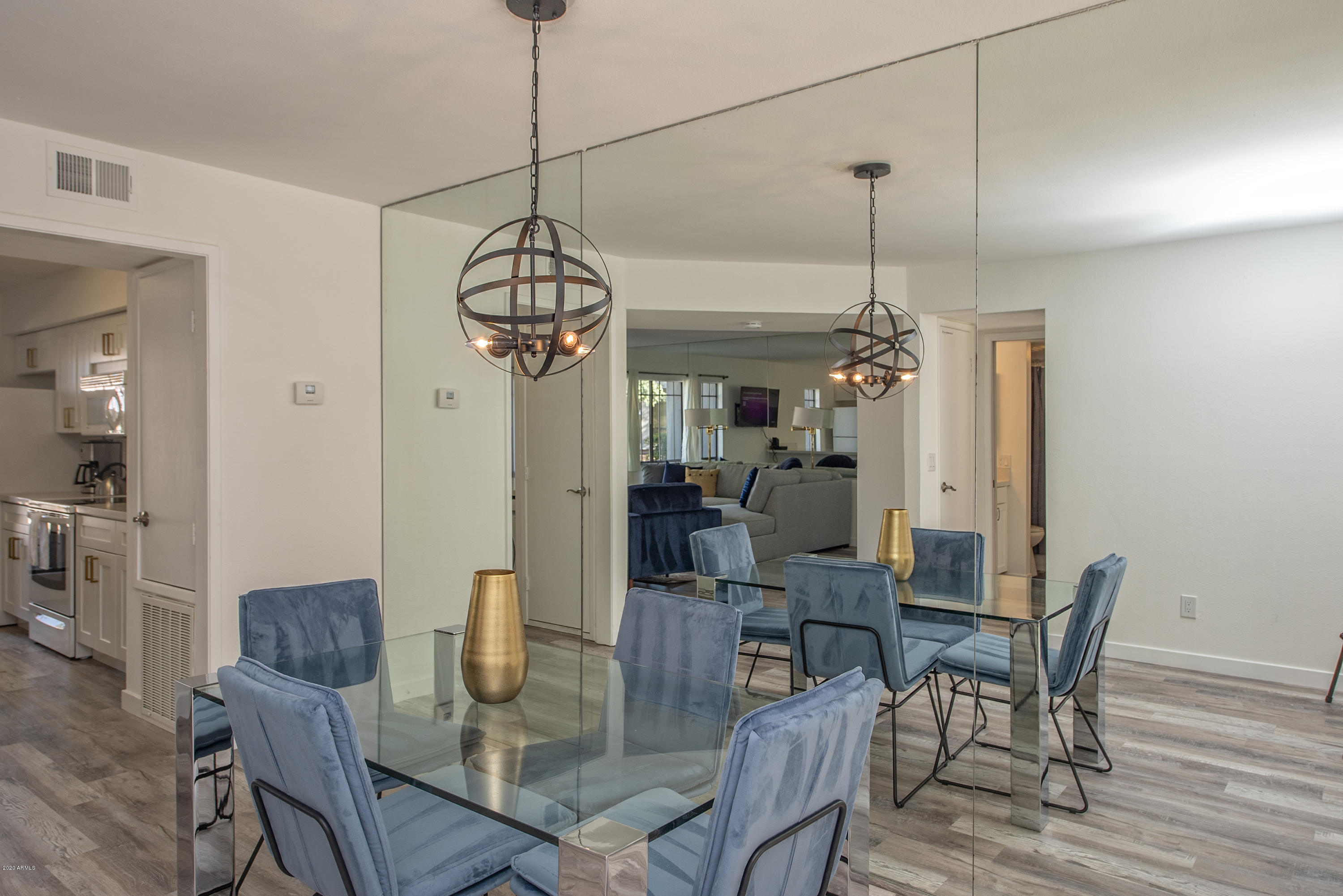 5209 North 24th Street, Unit 103 Phoenix, AZ 85016 - Photo 7 of 17 a view of a dining room with furniture window and wooden floor