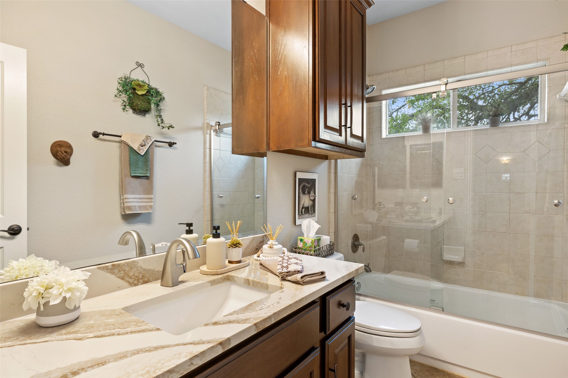 15208 Nightingale Lane Austin, TX 78734 - Photo 24 of 40 Bathroom featuring vanity and shower / bath combination with glass door