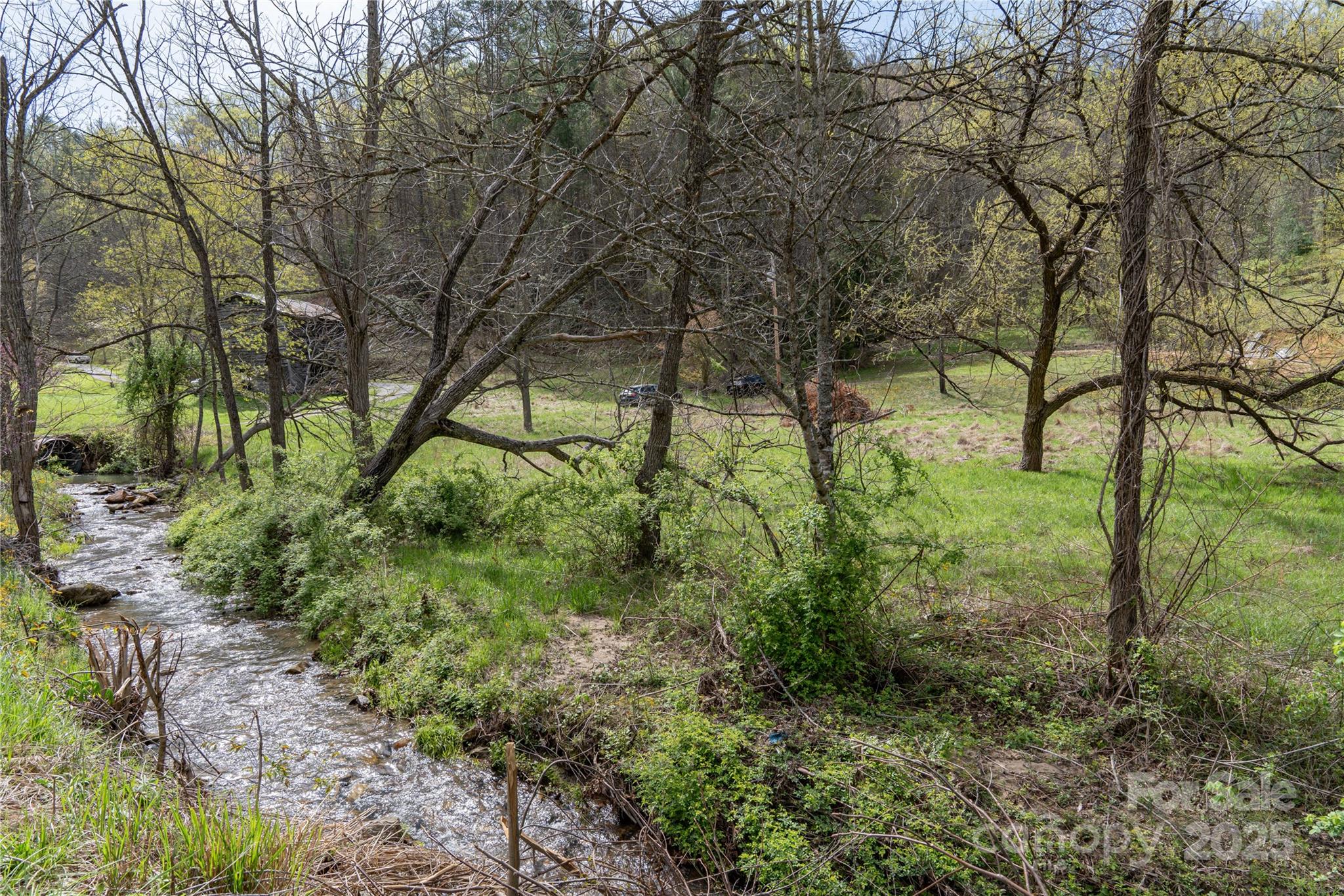 a backyard of a house with lots of green space
