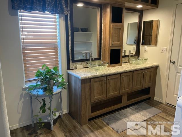 17845 Cold Springs Drive Reno, NV 89508 - Photo 5 of 12 a bathroom with a sink a potted plant and a mirror
