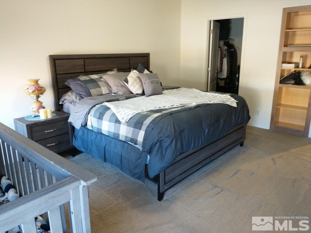 17845 Cold Springs Drive Reno, NV 89508 - Photo 6 of 12 a bedroom with a bed and walk in closet