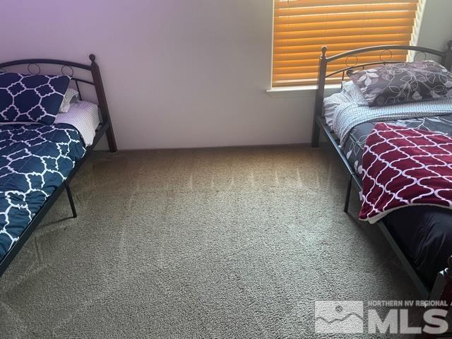 17845 Cold Springs Drive Reno, NV 89508 - Photo 8 of 12 a bedroom with a bed and a chair