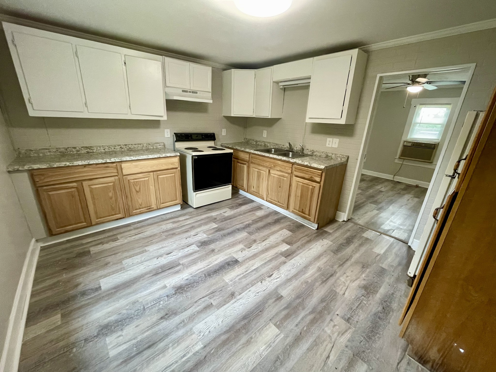 110 Shannon Road Leoma, TN 38468 - Photo 6 of 9 a kitchen with granite countertop a sink cabinets and stainless steel appliances
