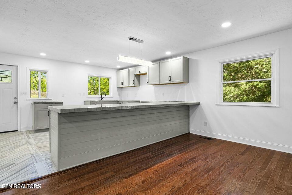 516 Delaware Avenue Oak Ridge, TN 37830 - Photo 16 of 43 a kitchen with stainless steel appliances granite countertop a stove a sink and a window
